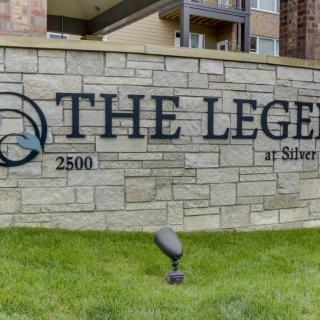 Entrance sign for The Legend apartment complex.
