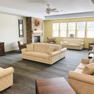 A cozy living room with comfortable sofas and a fireplace.