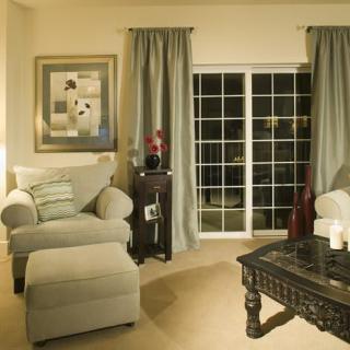A cozy living room with comfortable seating and elegant decor.