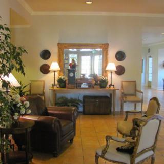 A cozy living room with elegant furnishings and warm lighting.