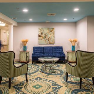 A stylish lobby featuring elegant seating arrangements and modern decorative elements.