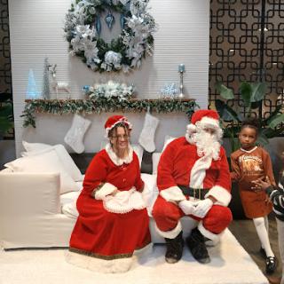 A joyful holiday scene featuring Santa and Mrs. Claus, ready to spread Christmas cheer.
