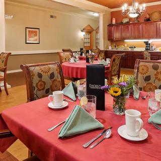 A neatly set dining table in an elegant restaurant setting.