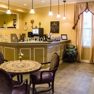 Cozy cafe interior with a decorative table and chairs.