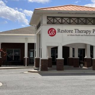 An exterior view of a therapy clinic with its signage visible.
