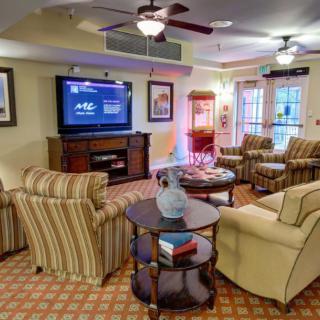 A cozy living room with comfortable seating, a television, and stylish decor.