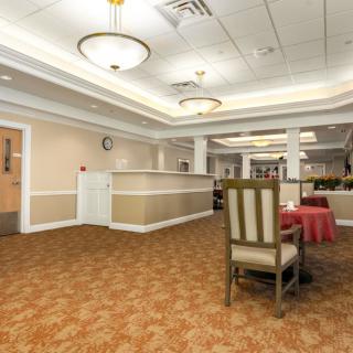 A spacious lobby with elegant lighting and comfortable seating arrangements.