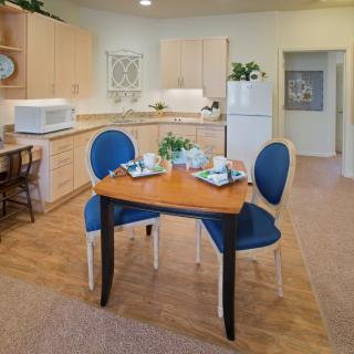 A cozy kitchen and dining area with modern amenities and stylish decor.