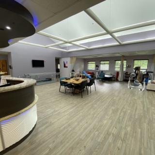 A modern office lobby with an open layout and contemporary furniture.