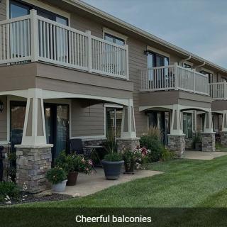 Modern apartment building with well-maintained balconies and gardens.