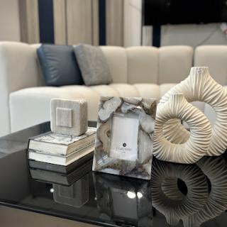A stylish living room setup showcasing elegant decor elements on a coffee table.