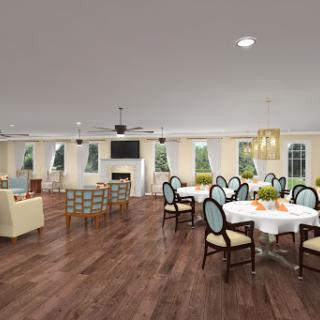 A spacious and elegantly designed dining area with modern furniture and ample natural light.