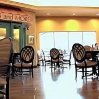 A spacious indoor dining area with tables and chairs.
