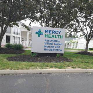 Signage for Mercy Health, indicating a healthcare facility providing various health services.