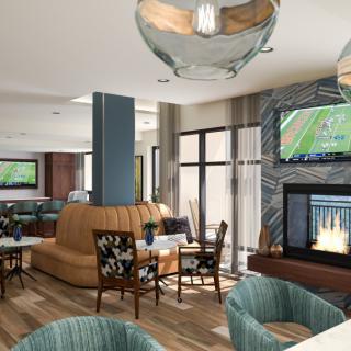 A modern seating area with a television and fireplace.