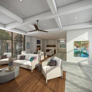 Modern living room with ample natural light and stylish decor.