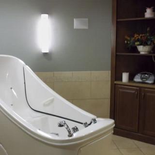 A modern bathtub in a stylish bathroom setting.
