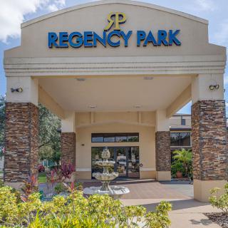 Entrance to Regency Park with a decorative fountain and landscaped surroundings.