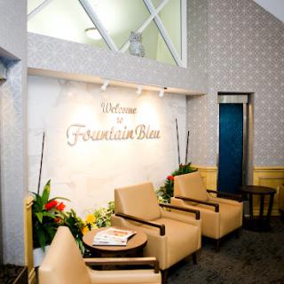 A welcoming lobby area featuring comfortable seating and decorative plants.