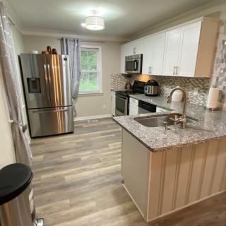 A modern kitchen with stainless steel appliances and sleek countertops.