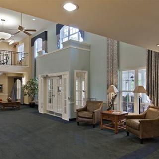 Spacious lobby with comfortable seating and large windows.