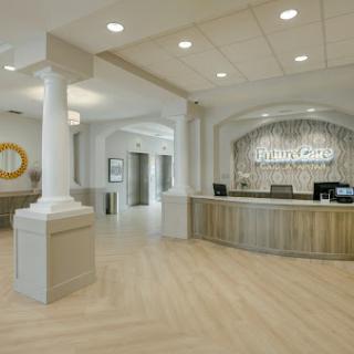 A modern reception area with elegant design and ample natural light.