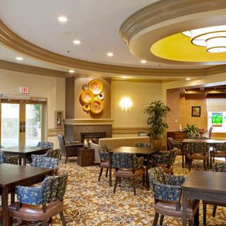 A modern dining area with elegant decor and ample seating.