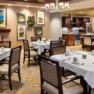 Elegant restaurant dining area with well-set tables and modern decor.