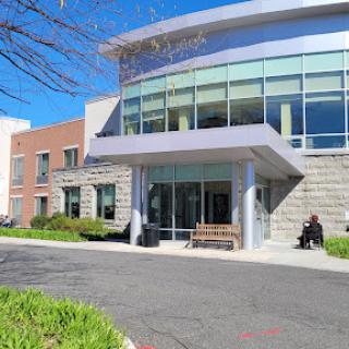 A modern building with large glass windows and a welcoming entrance.