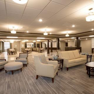 A modern lounge area with comfortable seating and elegant lighting.