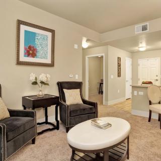 A modern living room featuring elegant furniture and tasteful decor.