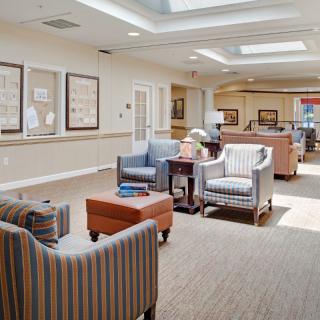A well-lit lobby area with comfortable seating and modern decor.