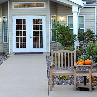 A welcoming entryway decorated with pumpkins for autumn.