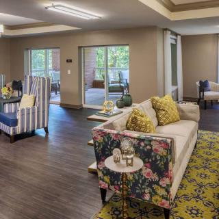 A cozy and well-designed living space featuring comfortable seating and modern decor.