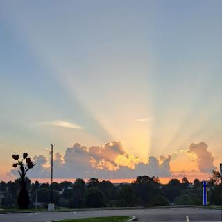 A stunning sunset with rays of light breaking through the clouds.