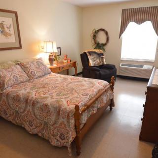Cozy bedroom with a comfortable bed and elegant decor.