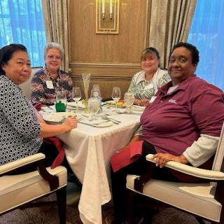A group of friends enjoying a delightful meal together at a cozy restaurant.