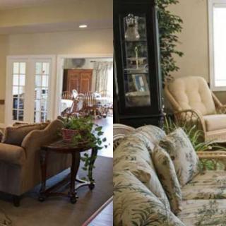 A cozy living room with comfortable seating and lush plants.