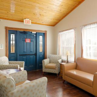 A cozy waiting room with comfortable seating and natural light.