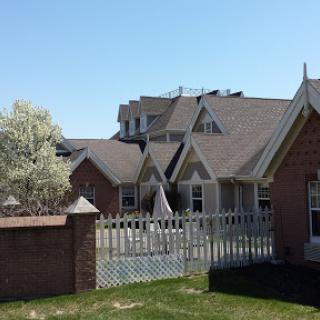 A view of a residential area featuring a mix of architectural styles and well-maintained outdoor space.