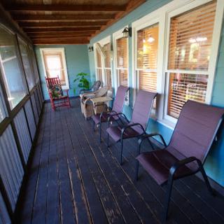 A cozy porch area with comfortable seating and a peaceful atmosphere.