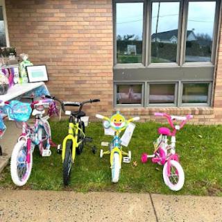 A row of colorful bicycles for children, ready for outdoor fun.