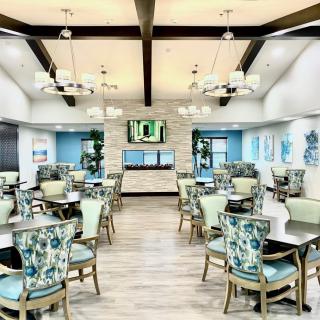 A modern dining area with elegant decor and ample seating.