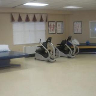 A gym room with exercise bikes and other fitness equipment.