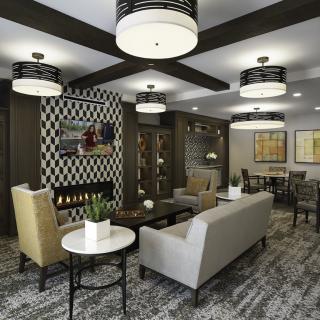 A modern living room with stylish furniture and decorative lighting.