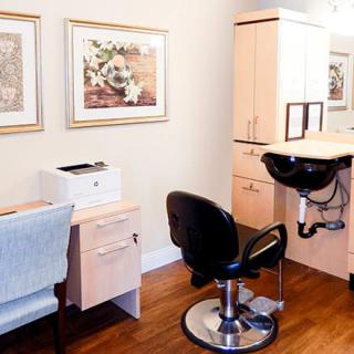 A well-organized salon interior with chairs and beauty equipment.