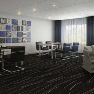 A modern conference room with sleek furniture and contemporary wall art.