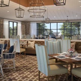 A modern restaurant dining area featuring stylish decor and comfortable seating.
