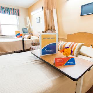 A well-equipped hospital room designed for patient comfort and care.