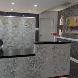 A modern reception area featuring elegant decor and a sleek design.